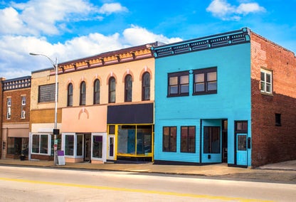 A row of colorful, vacant commercial property in rural Texas.
